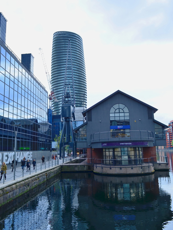 25 - The Millwall Inner Dock on the Isle of Dogs in London, featuring the distinctive curvy Baltimore Tower in the background